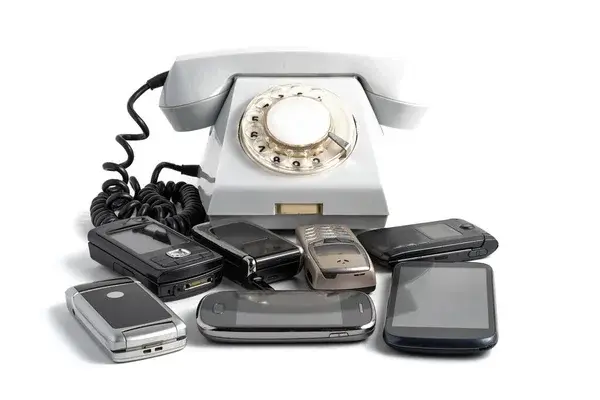 Rotary phone surrounded by mobile phones