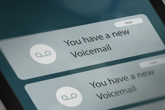 Smartphone screen displaying voice mail notifications